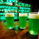 Group of glasses with foaming beer served for friends on bar